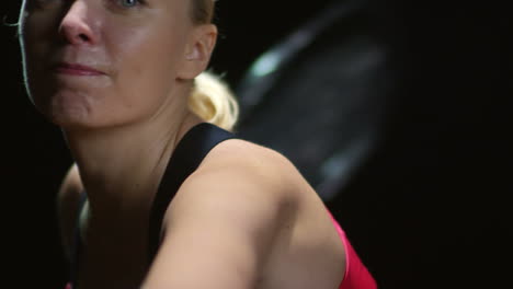 Front-View-Of-A-Blonde-Woman-In-Sportswear,-Sweating-And-Holding-A-Tennis-Racket