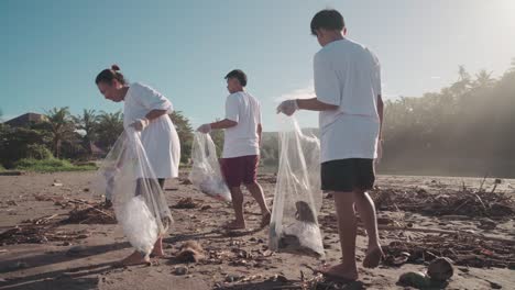 Group-Of-Local-Indonesian-People-Collecting-Trash-From-Beach