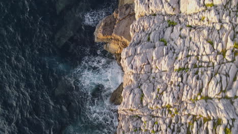 Close-Up-Of-Sea-Waves-Breaking-On-Rocky-Shore