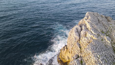 Aerial-View-Of-Sea-Waves-Breaking-On-Rocky-Shore-1