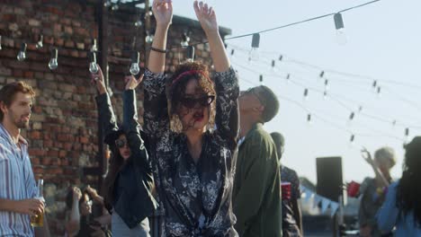 Young-Stylish-Woman-Dancing-And-Gaving-Fun-On-The-Rooftop