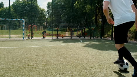Street-Football-Team-Training-On-Pitch-On-Sunny-Day
