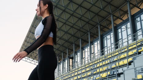 Beautiful-Sportive-Woman-Concentrating-Before-Outdoor-Exercise-In-The-Stadium