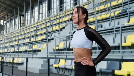 Beautiful-Sportive-Woman-Concentrating-Before-Outdoor-Exercise-In-The-Stadium-1