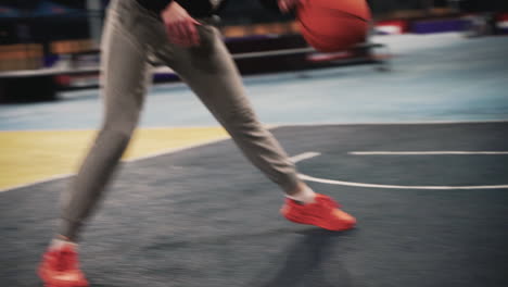 Close-Up-Of-A-Female-Basketball-Player-Training-And-Bouncing-The-Ball-On-Outdoor-Court-At-Night-1