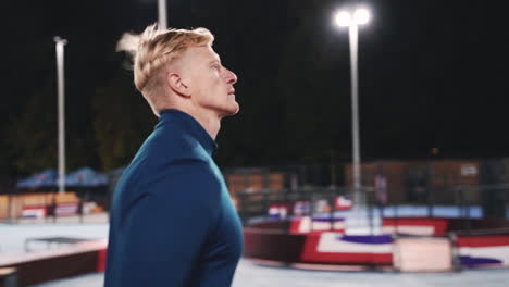 Focused-Blond-Man-Running-In-The-Park-At-Night-1