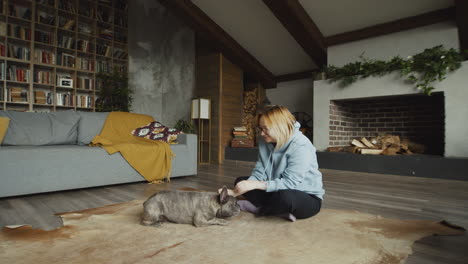 Red-Haired-Woman-And-Her-Bulldog-Dog-On-The-Carpet-On-The-Living-Room-Floor-2