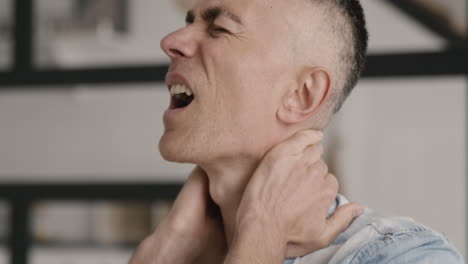 Middle-Aged-Man-Having-Neck-Pain-At-Home