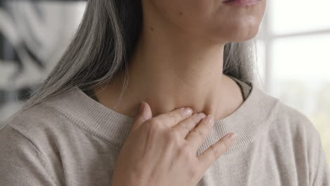 Close-Up-Of-A-Woman-Having-Throat-Pain-And-Touching-Her-Neck