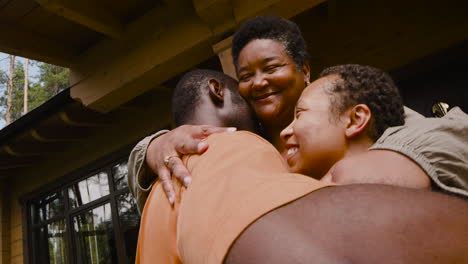 Happy-Couple-Visiting-Man's-Mother-And-Then-They-Embracing-Each-Other-Outside-Home