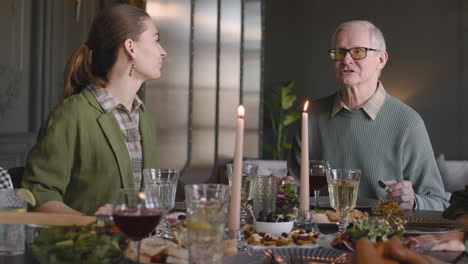 Grandfather-Telling-Something-Funny-While-Having-Meal-With-His-Family-At-Home