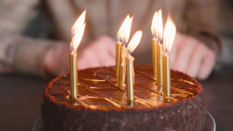 Close-Up-Of-Lighted-Candles-On-Birthday-Cake