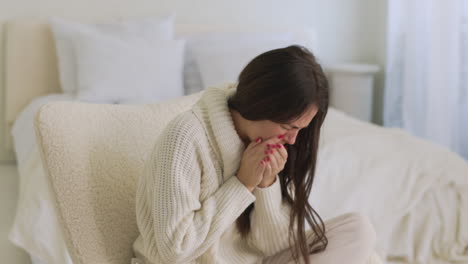 Sick-Woman-Coughing-Sitting-On-Chair-In-Bedroom-At-Home