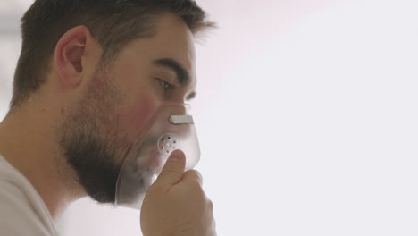 Close-Up-Of-A-Sick-Man-Breathing-Through-Oxygen-Mask-3