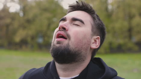Portrait-Of-Man-Breathing-Heavily-At-Park-In-The-Morning