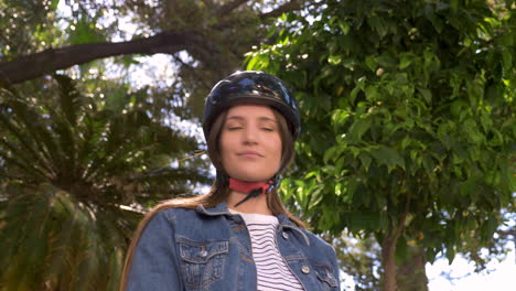 Young-Woman-With-Electric-Scooter-In-The-City-Putting-On-Helmet-1
