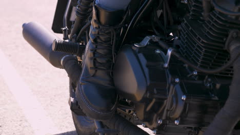 Close-Up-Of-A-Moto-Biker-Boot-On-A-Motorcycle