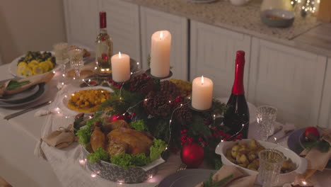 Traditional-Delicious-Food-And-Burning-Candles-On-Christmas-Dinner-Table-3