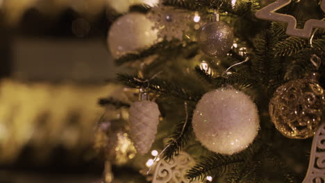Close-Up-View-Of-A-Christmas-Tree-With-White-And-Silver-Christmas-Decorations