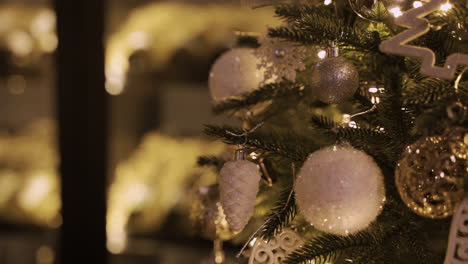Close-Up-View-Of-A-Christmas-Tree-With-White-And-Silver-Christmas-Decorations-1