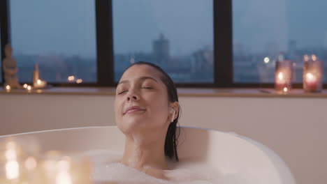 Woman-Listening-To-Music-With-Earphones-While-Taking-A-Bath-In-The-Bathtub-1