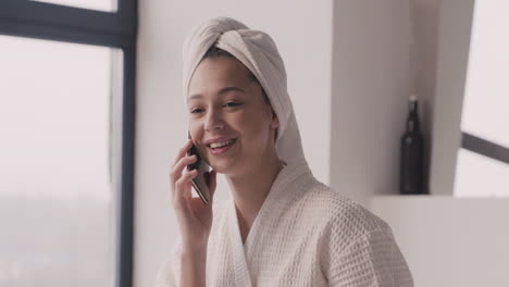 Woman-In-Bathrope-With-A-Towel-In-Her-Head-Talking-On-The-Phone