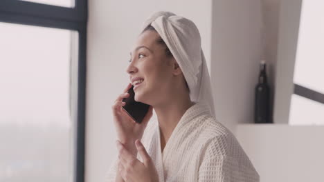 Woman-In-Bathrope-With-A-Towel-In-Her-Head-Talking-On-The-Phone-1