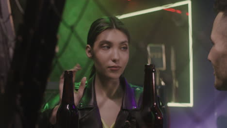 Beautiful-Girl-Annoying-By-Man-At-Disco,-Taking-Beer-And-Leaving-Him-Alone