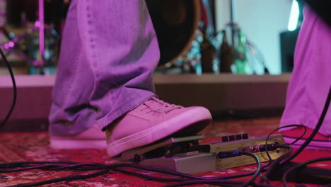 Close-Up-Of-An-Unrecognizable-Musician's-Foot-Pressing-Effects-Pedal-In-Recording-Studio