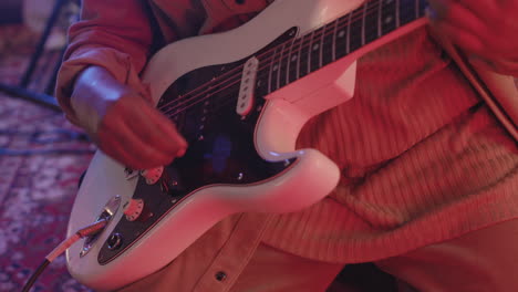 Close-Up-Of-An-Unrecognizable-Musician-Playing-Electric-Guitar-In-Recording-Studio-1