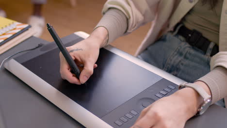Close-Up-Of-Hand-Drawing-On-A-Digital-Tablet