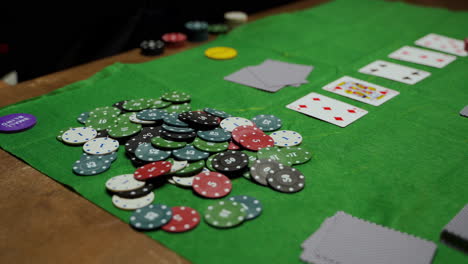 Camera-Focuses-On-Poker-Chips-And-Playing-Cards-On-The-Table