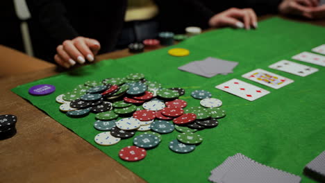 Camera-Focuses-On-Poker-Chips-And-Playing-Cards-On-The-Table-1