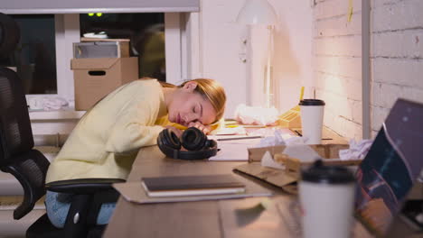 Tired-Young-Woman-Taking-Break-To-Rest-And-Having-Nap-At-Workplace