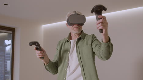 Senior-Man-Playing-At-Home-With-Virtual-Reality-Goggles-Headset-1