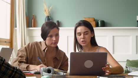 Camera-Focuses-On-Two-Girls-Of-A-Study-Group-Who-Are-Talking-And-Looking-At-Laptop-2