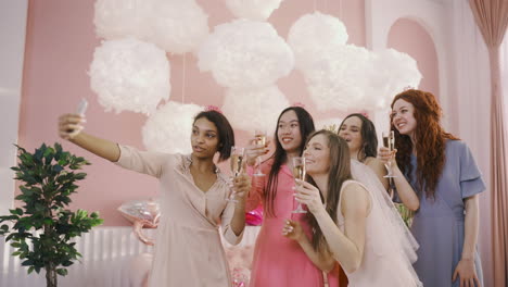 Group-Of-Friends-Taking-A-Selfie-With-Smartphone-At-A-Bachelorette-Party