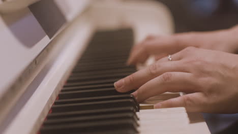 Close-Up-Of-A-Female-Hands-Playing-Piano-2