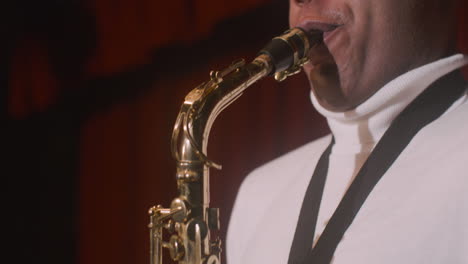 Close-Up-View-Of-Latin-Man-Playing-Sax-During-Live-Music-Perfomance-2
