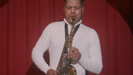 Front-View-Of-Latin-Man-Playing-Sax-During-Live-Music-Perfomance
