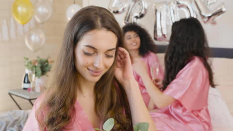 Brunette-Woman-Holding-Bouquet,-Wearing-Pink-Silk-Nightdress,-Smiling-And-Looking-At-Camera