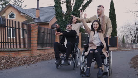 Woman-And-Man-Running-With-Her-Disabled-Friends-In-Wheelchair-And-Having-Fun-Together-2