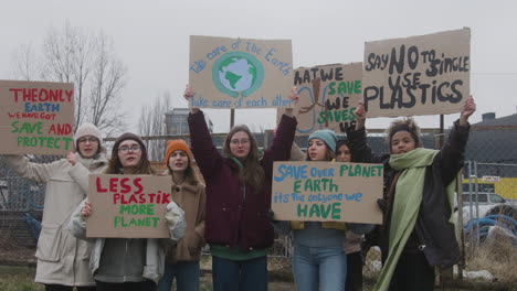 Group-Of-Young-Female-Activists-With-Banners-Protesting-Against-Climate-Change