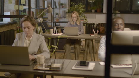 American-Man-And-Women-Employees-Working-On-Computer-Sitting-At-Desk-In-The-Office-1