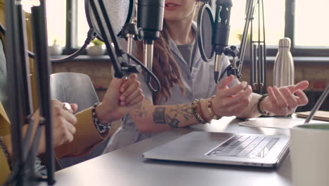 Man-Hands-And-Woman-Hands-Gesticulating-On-The-Table-While-They-Recording-A-Podcast
