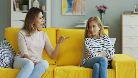 Woman-Talking-With-Her-Impolite-Teen-Daughter-And-Educating-Her-On-The-Sofa-In-The-Living-Room