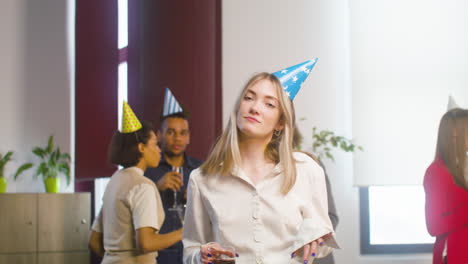 Happy-Blonde-Woman-Dancing-And-Having-Fun-At-The-Office-Party-1
