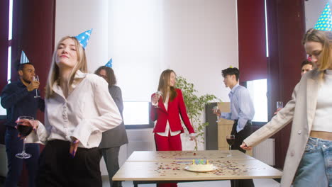 Group-Of-Multiethnic-Colleagues-Dancing-And-Having-Fun-Together-At-The-Office-Party