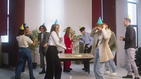 Group-Of-Multiethnic-Colleagues-Dancing-And-Having-Fun-Together-At-The-Office-Party-2
