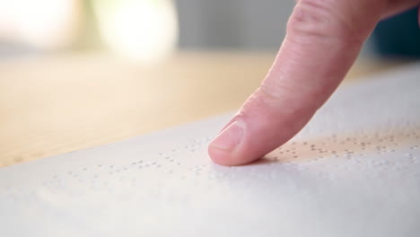 Close-Up-Of-An-Unrecognizable-Blind-Man-Reading-A-Braille-Book-1